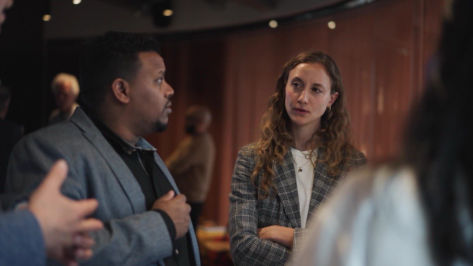 A workshop participant listening as another speaks, from the CFYE documentary Beyond the Fund.