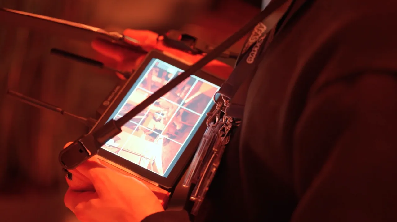 A close-up of an on-camera monitor with its sunshade
