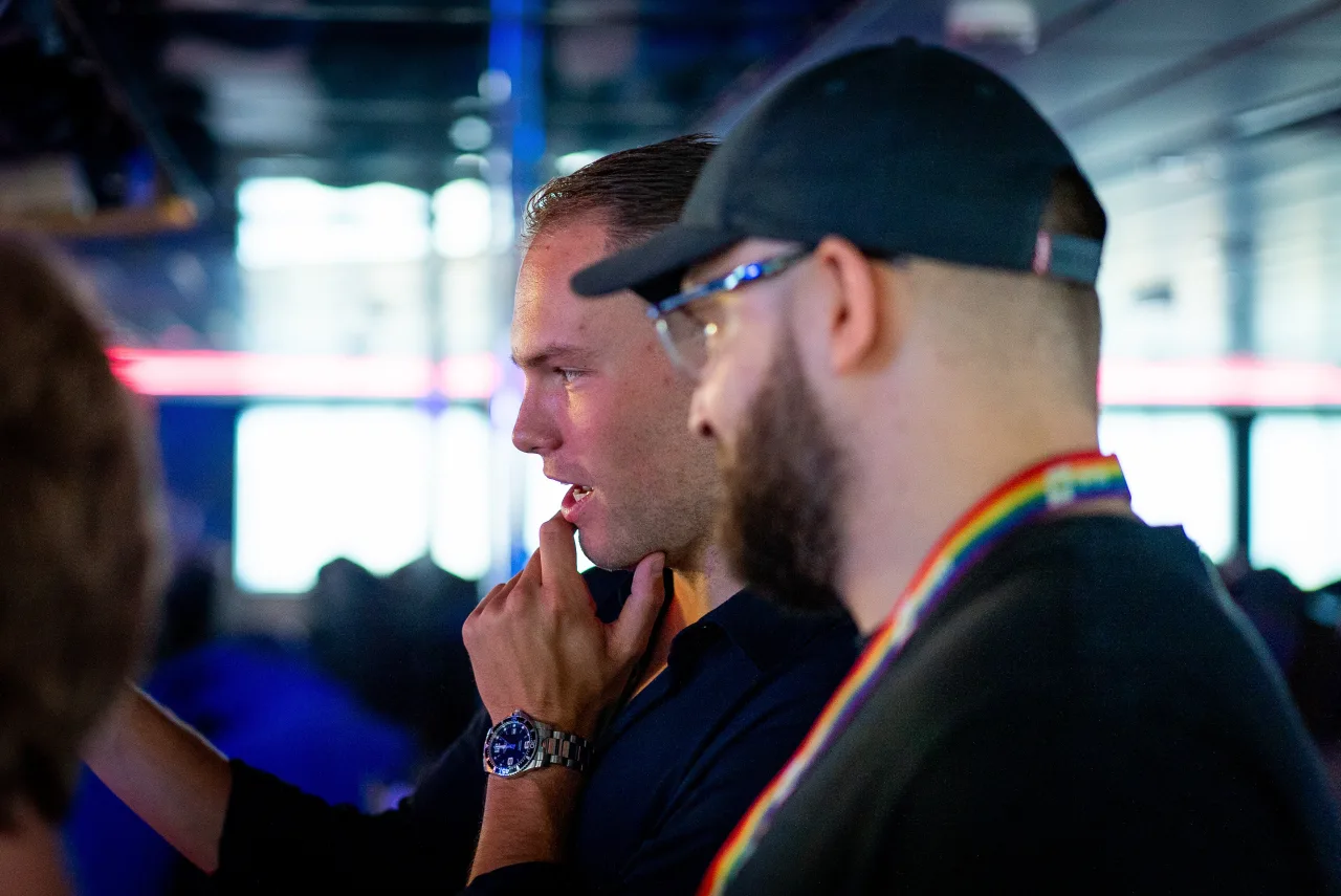 Two crew members talking through a shot on location